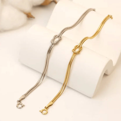 Gold and Silver Forever Knot Bracelets shown together